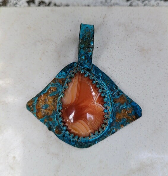 Copper orange agate patina evil eye pendant